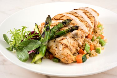 Grilled Chicken Breast with Garnish and Asparagus