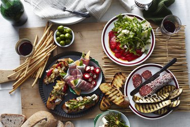 Plates of bread, meats and vegetables