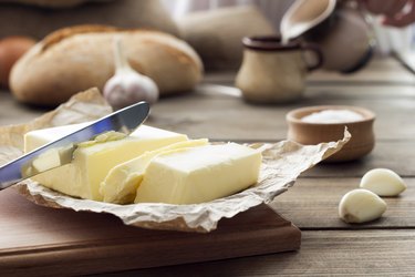 butter knife , bread , garlic and milk