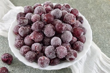 Frozen grapes in a white bowl