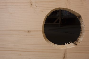 Europe, Greece, 2018: View Of Wooden Plank With Hole Cut By Saw (So That Plumbing Pipe Can Pass Through)