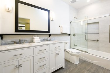 Bathroom vanity with large framed mirror