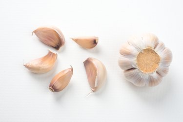 Top view of isolated garlic clove, seasoning on white background