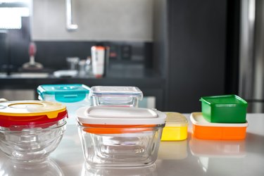 colorful plastic pots on top of kitchen counter