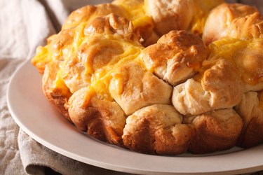 Homemade monkey bread with cheese macro on a plate. horizontal