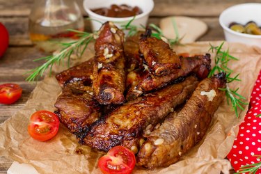 Baked barbecue glazed spare ribs of pork riblets with garlic