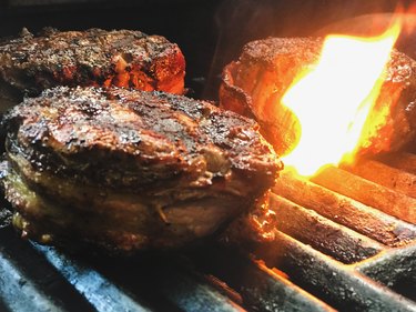 Grilled Elk Bacon Wrapped Tenderloin being cooked on gass grill in Springfield MO