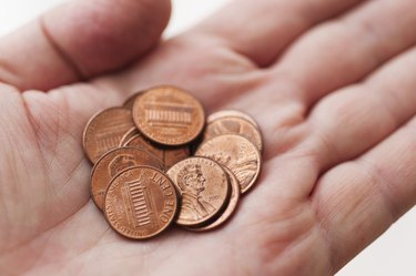 Male hand holding coins