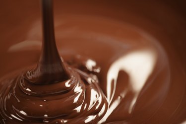 melted dark chocolate flows closeup