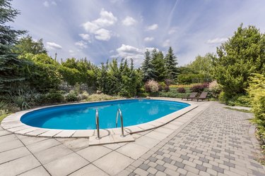 Oval swimming pool in garden