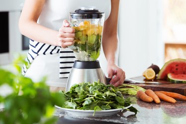 Vegetarian preparing vegan smoothie