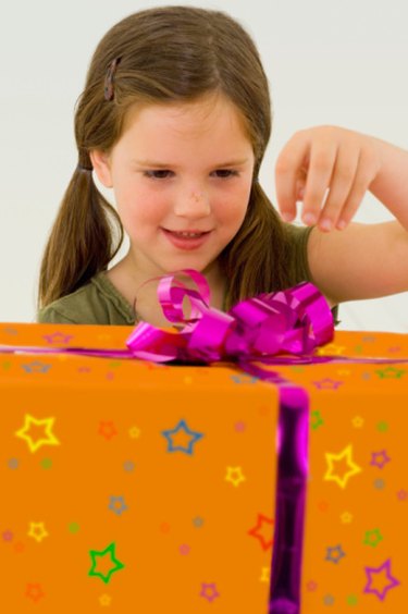 Little girl unpacking birthday gift hi-res stock photography and images -  Alamy