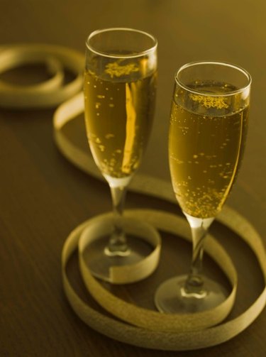 Toast to a 50th birthday with a glass of champagne.