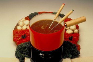 How do gas fondue burners enhance your fondue experience?