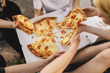 Friends sharing a pizza