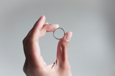 Cropped Image Of Woman Holding Ring