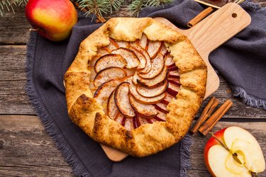 Baked galette or open pie with apples on the table