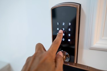 One hand operating the room password lock