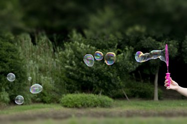 Hand Holding Bubble Wand