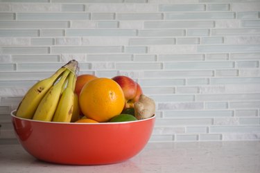 Fresh fruit in red bowl