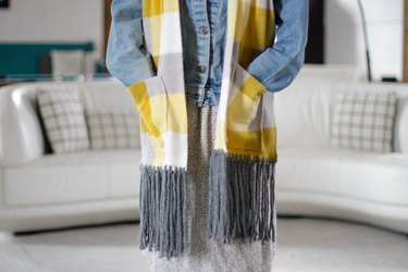 person wearing fleece pocket scarf