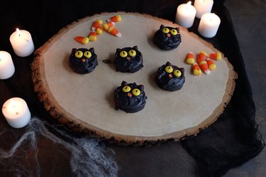 DIY chocolate-dipped Oreo cookies decorated to look like black cats