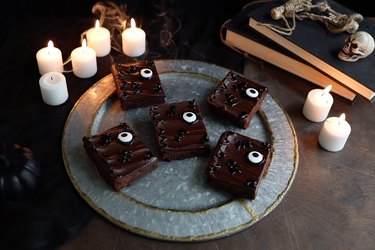 DIY chocolate brownies decorated with candy eyes to look like spell books