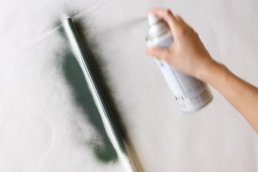 Spray painting PVC pipe green