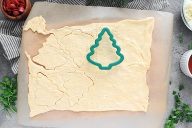 Cut out Christmas tree crescent pieces