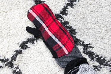 Take an old flannel shirt that's been hanging around the thrift store or maybe even a loved ones old shirt to create some mittens.