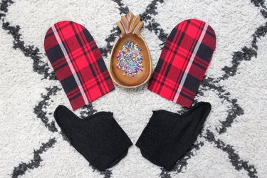 Take an old flannel shirt that's been hanging around the thrift store or maybe even a loved ones old shirt to create some mittens.