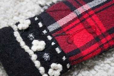 Take an old flannel shirt that's been hanging around the thrift store or maybe even a loved ones old shirt to create some mittens.