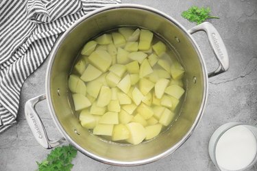 Boil potatoes until tender