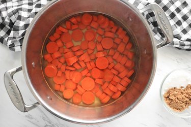 Boil carrots until tender