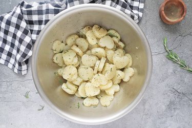 Toss potatoes with oil and spices