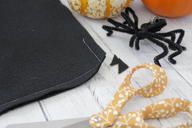 This not so itsy-bitsy spider DIY web pillow will create that spooky vibe you're going for.