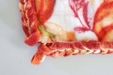 This soft and delicate DIY throw is just right for snuggling up on the couch or or adding a touch of warmth to your bed.