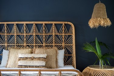 Interior bedroom at cozy house with wicker decor