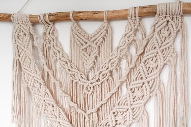 Wall decor in the style of weaving macrame handmade from beige natural threads