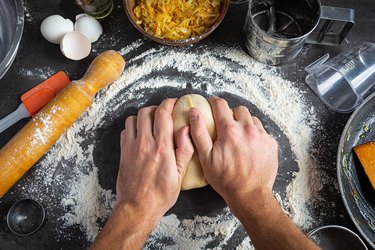 Homemade making dough of pizza, pierogi. Preparation dough for cooking