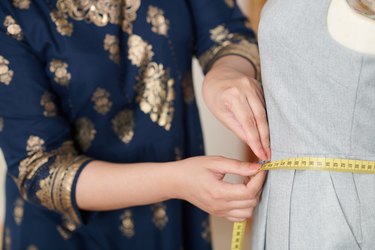 Tailor Measuring Waist of Dress