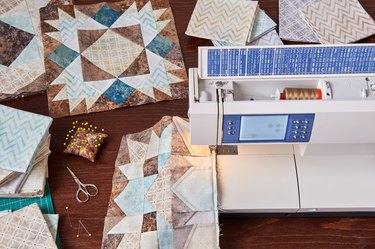 Sewing machine with patchwork block of quilt, top view