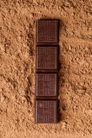 Chocolate bar with filling on brown background