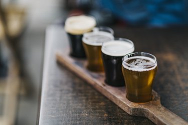 Close-up shot of a variety of beers, also known as a beer flight, as served in a microbrewery.