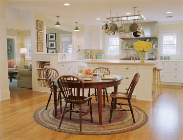 Pots and pans hanging above kitchen island