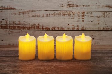 Flameless candles electronic on wooden background