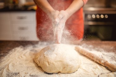 Woman preparing dough for bread