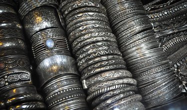 Rows of Narrow and Wide Silver Bangles for Sale