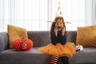 Children playing with Halloween decoration