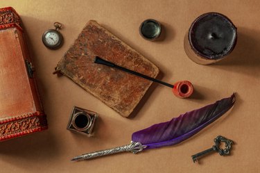 Private detective investigation game objects. A vintage pipe, a quill pen etc